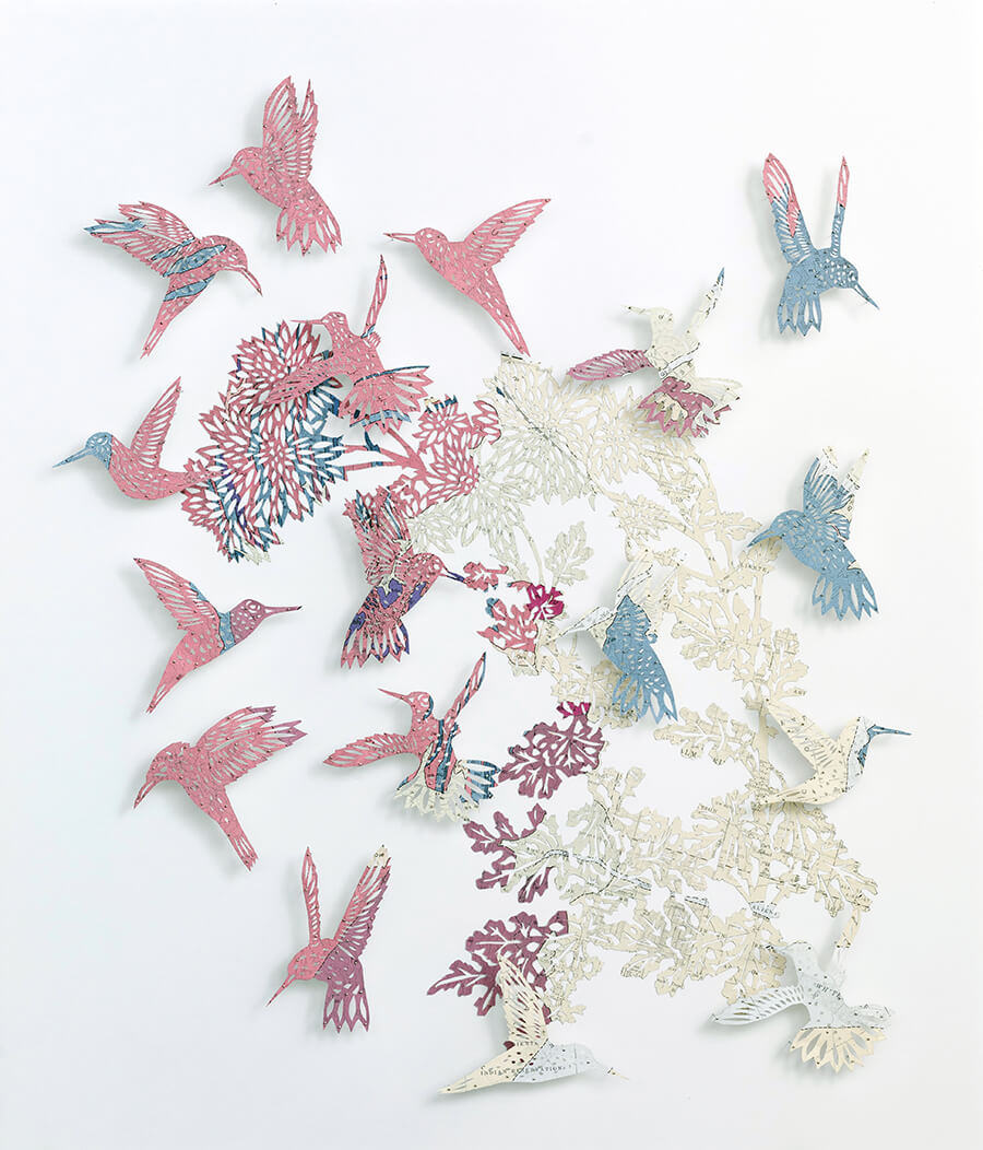 n The Pink by Claire Brewster. A paper sculpture of pink and blue hummingbirds hand-cut from a vintage geological map of Palm Springs, California.