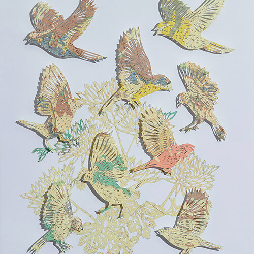Going For Gold by Claire Brewster. A paper sculpture of birds and foliage hand-cut from a vintage geological map of the Dos Lomas Quadrangle, New Mexico, featuring prominent yellow and gold tones.