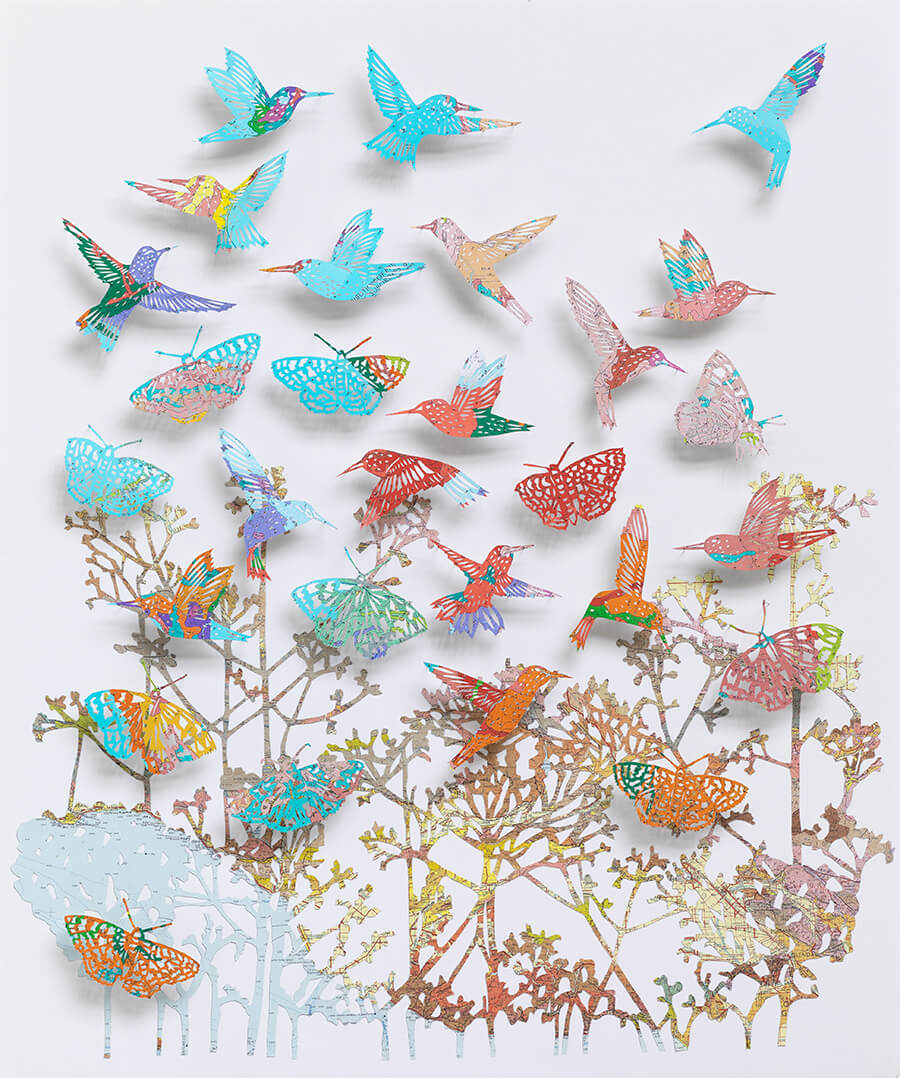 "We love life by Claire Brewster. A vibrant paper sculpture featuring hummingbirds and butterflies hand-cut from digitally printed vintage maps of California in bright blues, pinks, and oranges, commissioned for Stanford Children's Hospital."